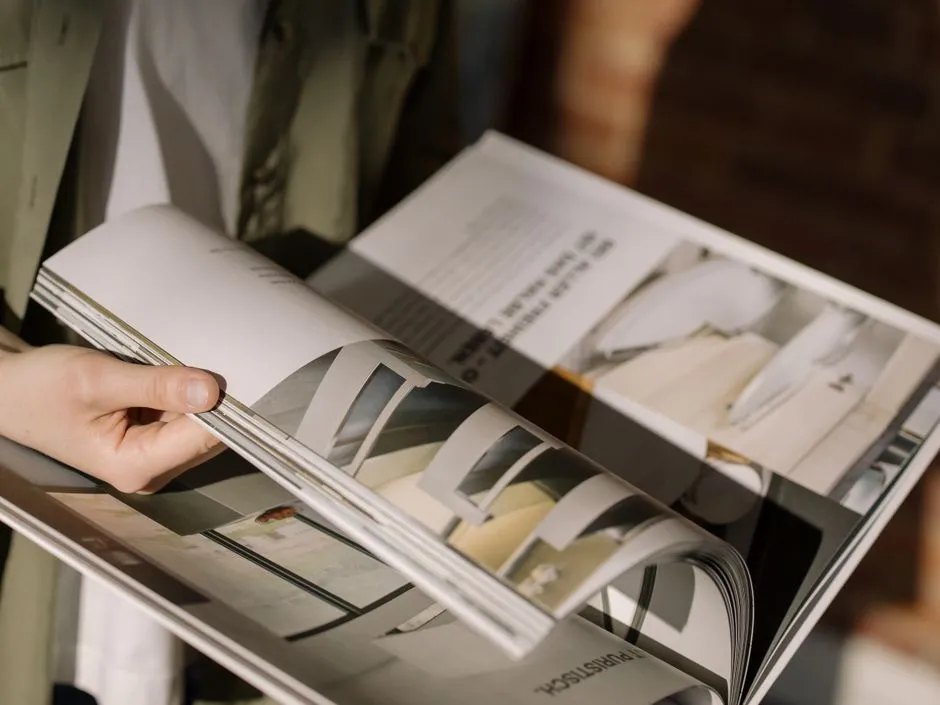Close-up of a magazine's pages caught mid-turn, illustrating the page-turning format flipbooks recreate online